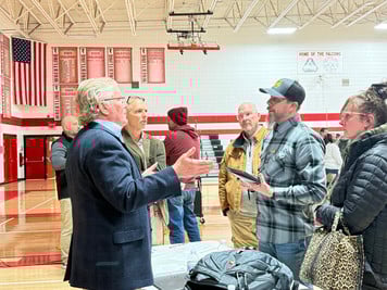 Residents talk with Interim Supt. Todd Bugnacki and Mike Clark from Baird Finance.